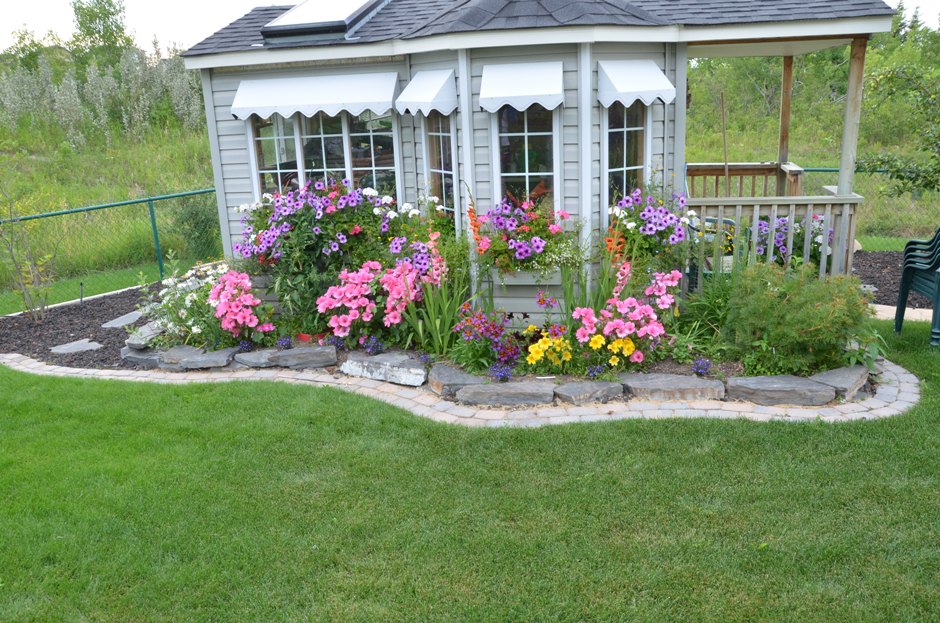 Calgary sustainable landscaping hardscaping softscaping water managment landscape garden flowerbed boarder paving stone