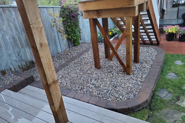 calgary backyard drainage solutions-raised gravel bed- tree bed