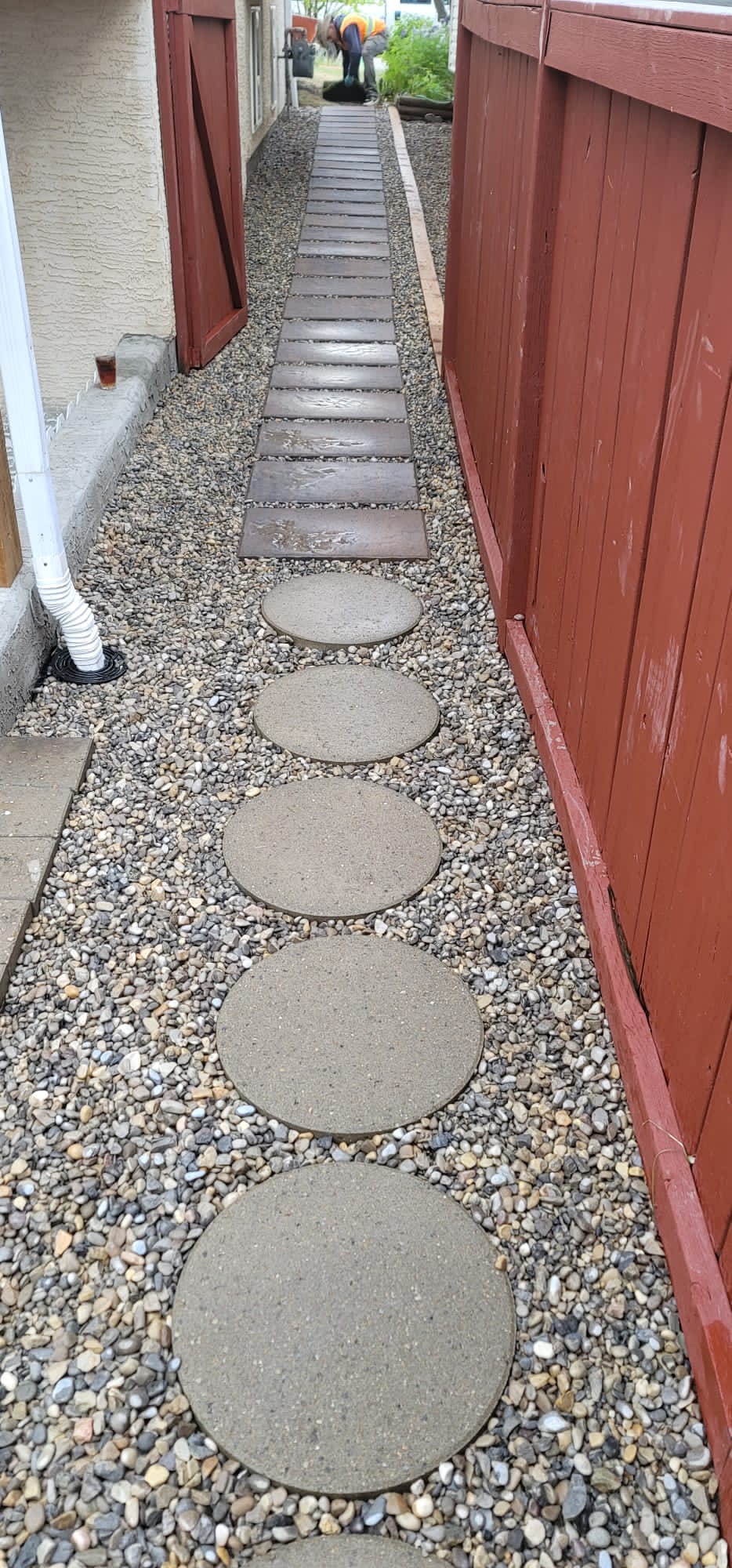 A beautifully landscaped garden stone pathway adorned with carefully arranged pathway stones, highlighting the expertise of CALGARY landscapers