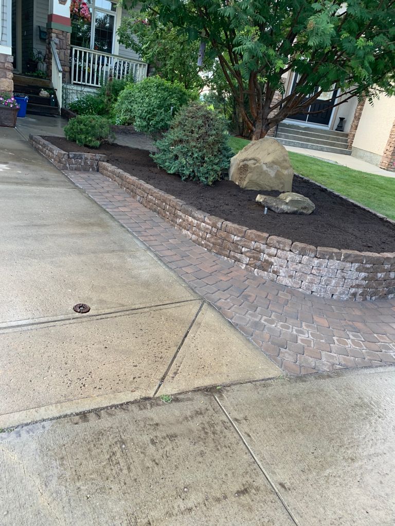 Valley-Ridge-Calgary-garden-front-yard-stone-flowerbeds-cobble-stone-