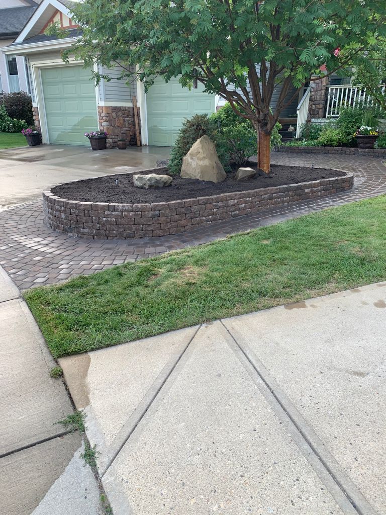 Valley-Ridge-Calgary-garden-front-yard-stone-flowerbeds-cobble-stone-