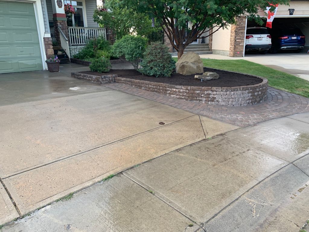 Valley-Ridge-Calgary-garden-front-yard-stone-flowerbeds-cobble-stone-