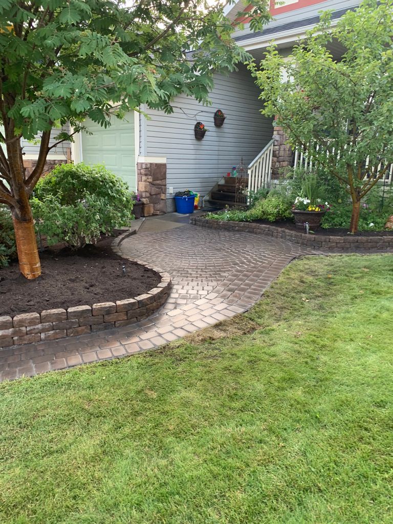 Valley-Ridge-Calgary-garden-front-yard-stone-flowerbeds-cobble-stone-