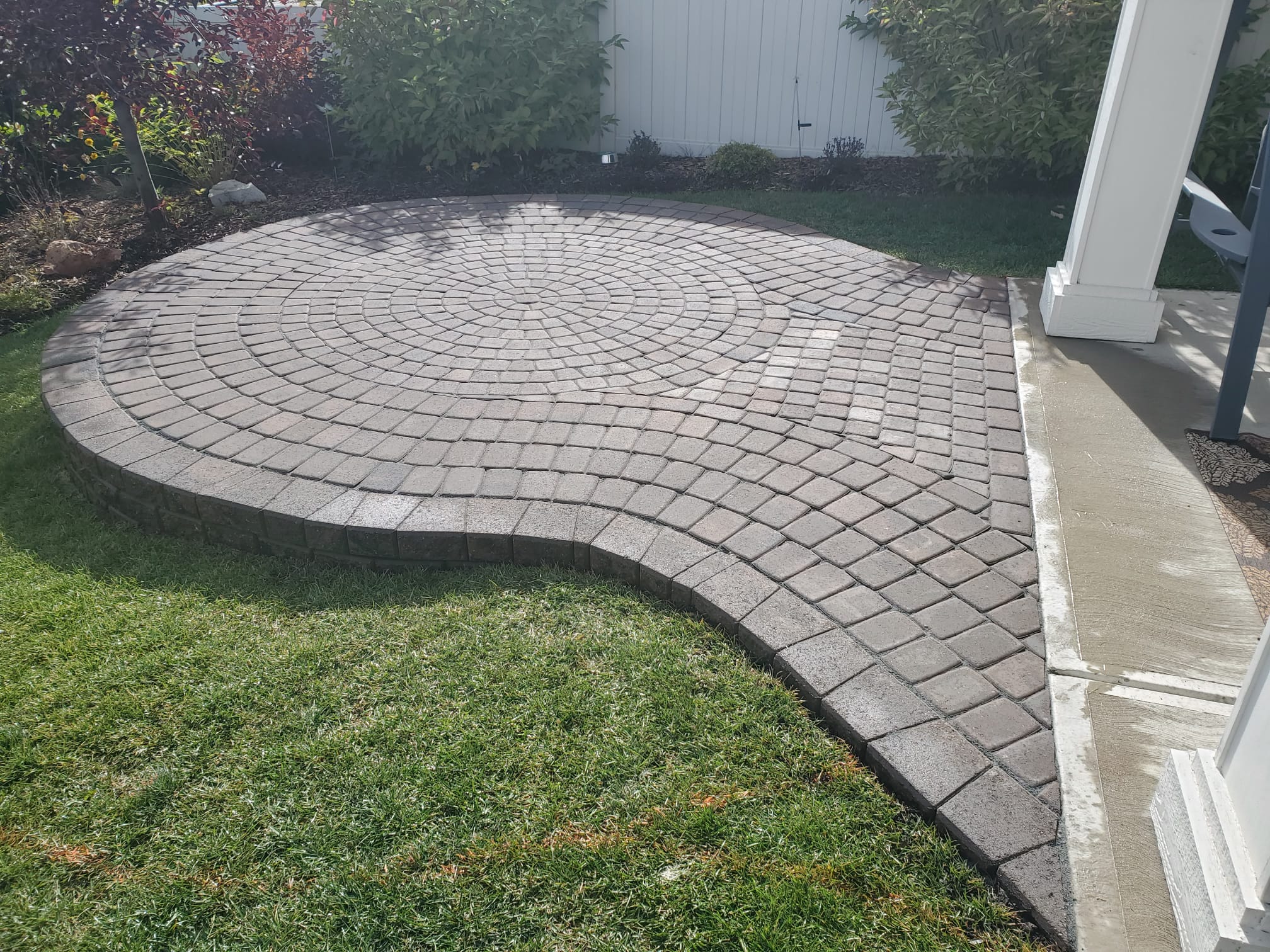 calgary landscaping backyard ideas raised fire pit paving stones patio