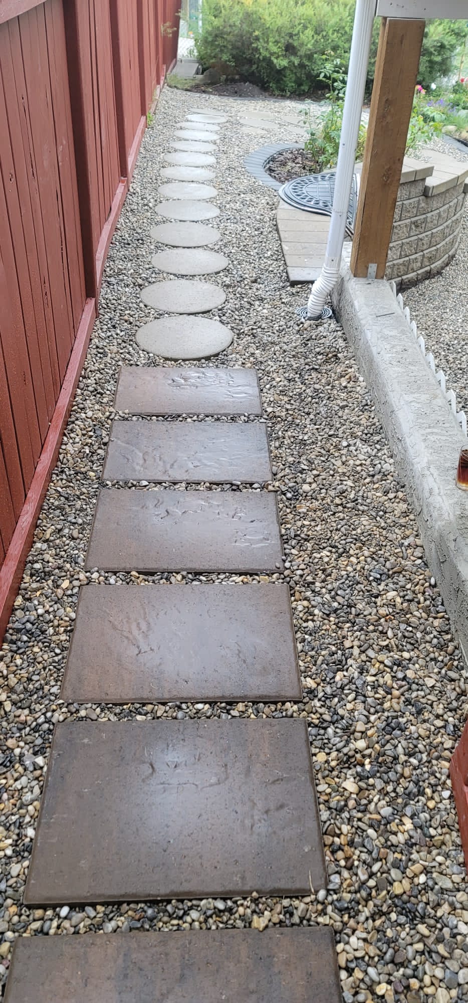 Arbour-Lake-Calgary-Landscaping-side-yard-stepping-stones-french-drain-rocks-