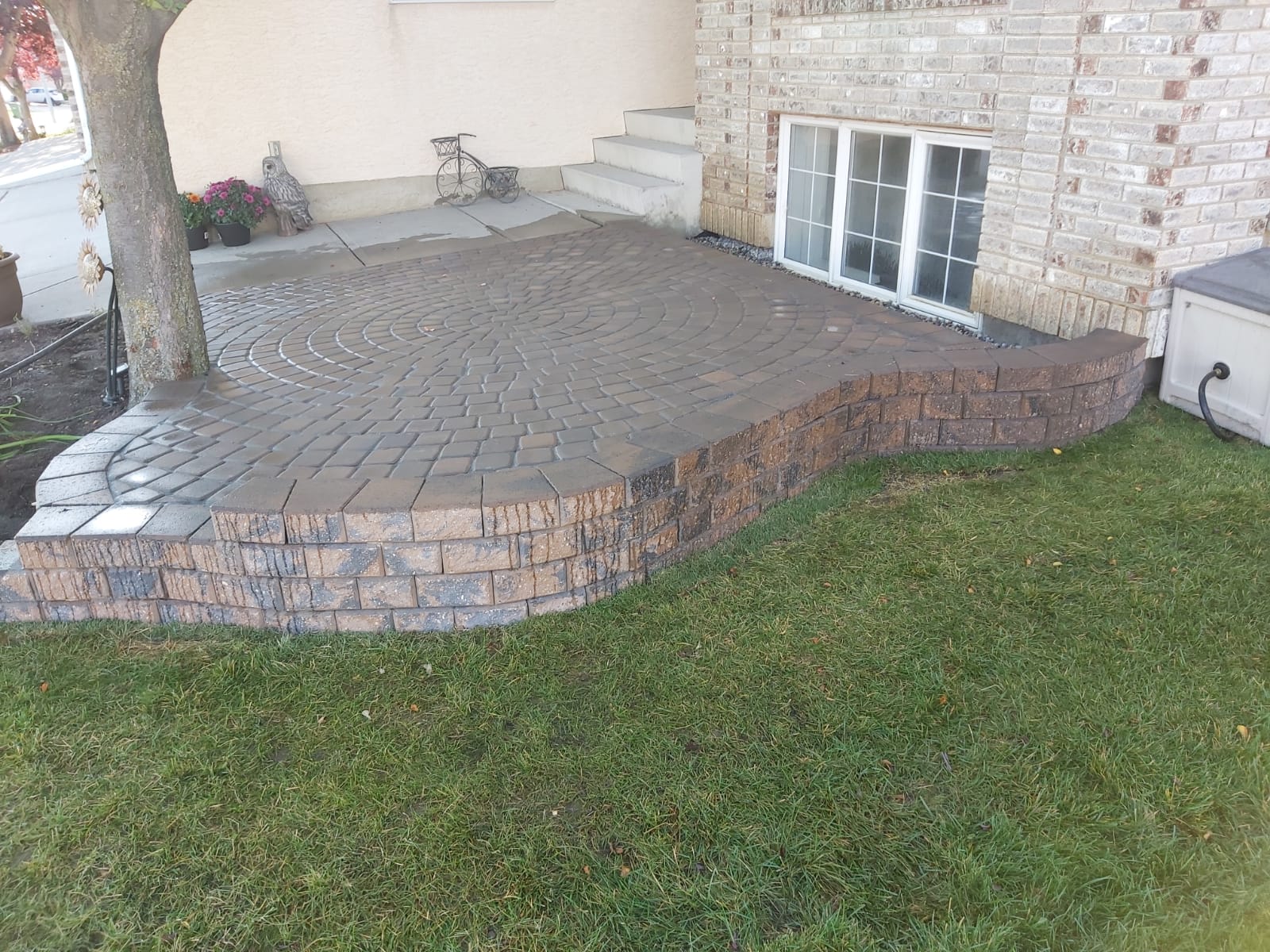 LANDSCAPING raised front patio window well and tree bed garden
