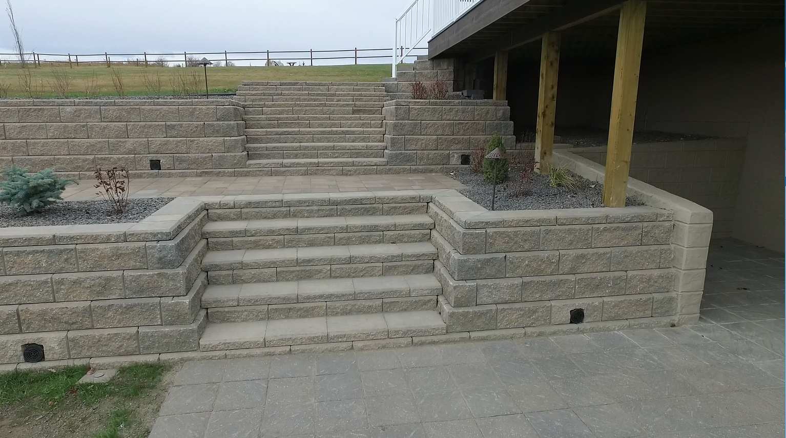 Calgary Retaining Walls builder contractor  Stairs installed between two concrete block wall calgary