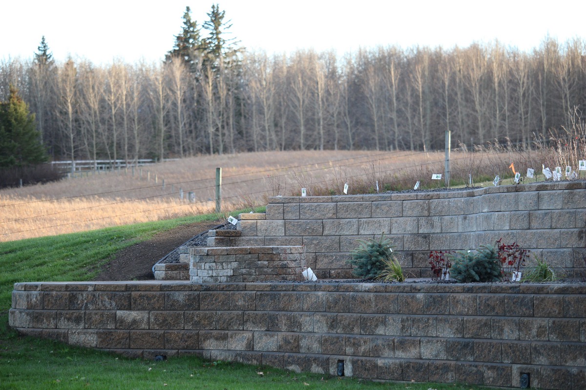 Fire-pit patio retaining wall Calgary using concrete block retaining wall builders near me