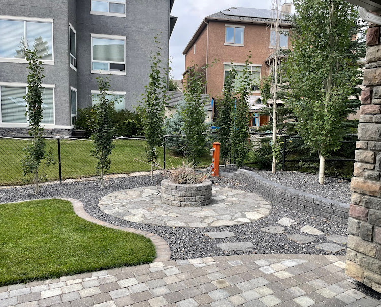 Calgary-low-maintenance-french-drain-firepit-landscaping steps- xeriscapes-calgary landscaping-yard-calgary-fix water drainage issue-artscape-sustinable-landscape