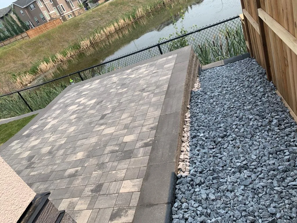 Rocky Ridge NW Calgary New home Landscaping Patio Retaining wall photo 4