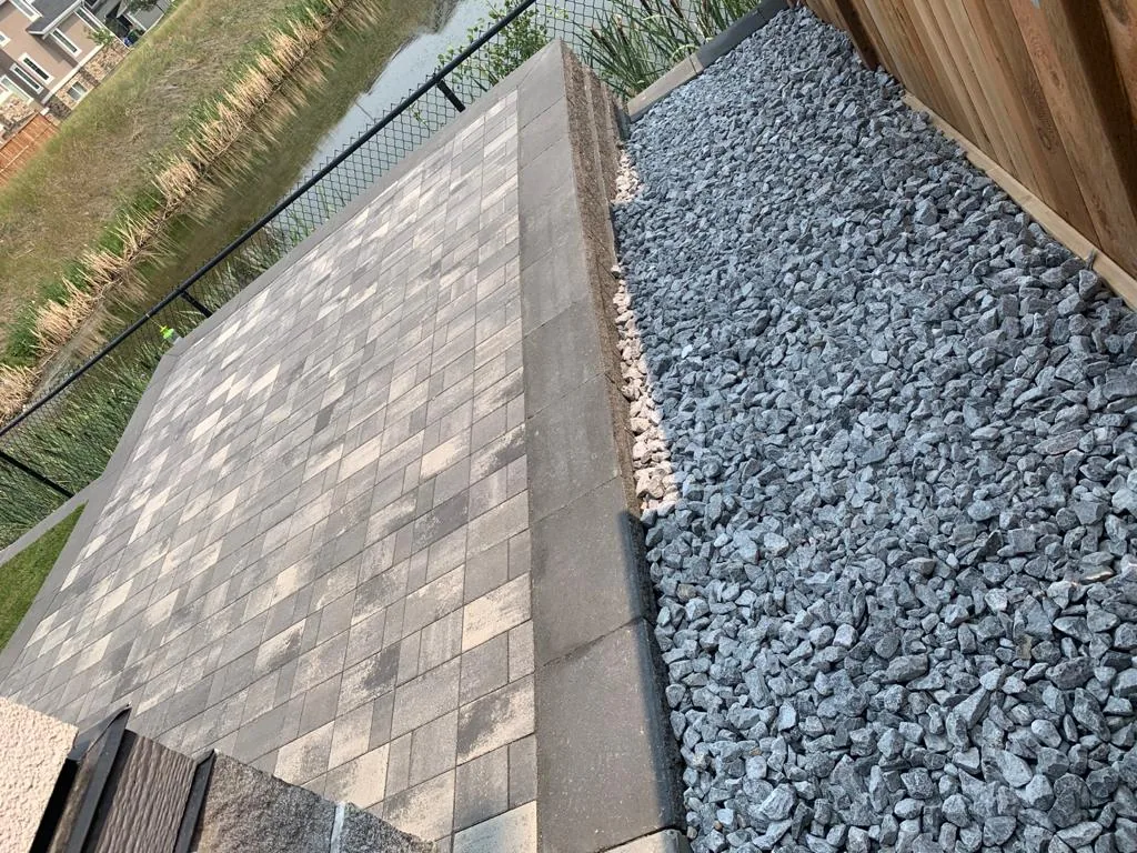 Rocky Ridge NW Calgary New home Landscaping Patio Retaining wall photo 3