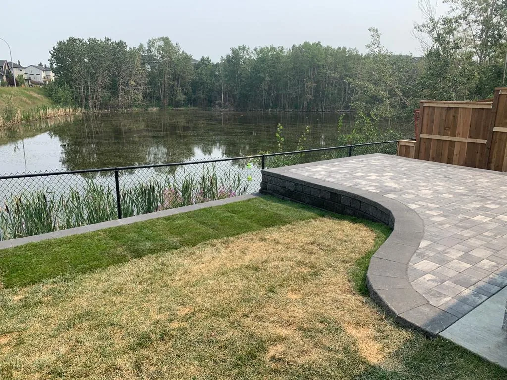 Rocky Ridge NW Calgary New home Landscaping Patio Retaining wall photo 2