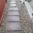 Arbour-Lake-Calgary-Landscaping-side-yard-stepping-stones-french-drain-rocks-