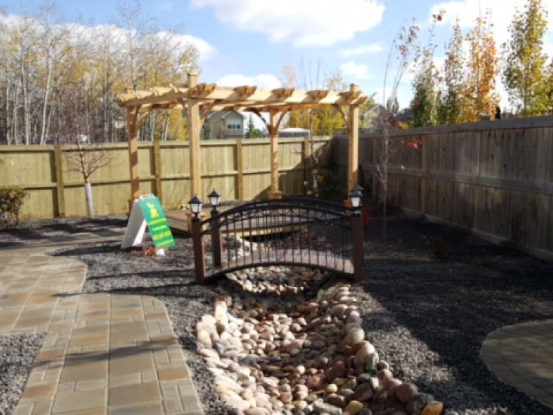 Aspen-Calgary-landscaping-backyard-pathway-deck-dry-creek-rocks-plants