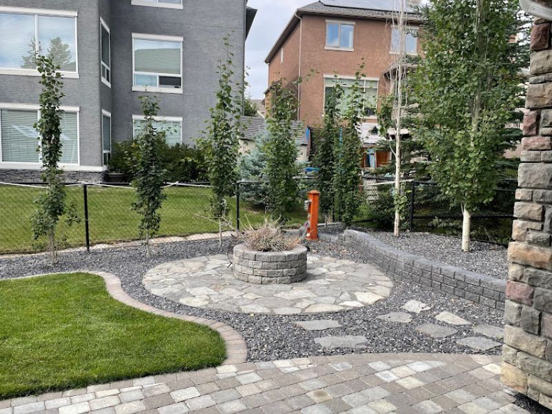 Calgary-low-maintenance-french-drain-firepit-landscaping steps- xeriscapes-calgary landscaping-yard-calgary-fix water drainage issue-artscape-sustinable-landscape