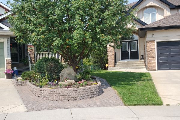 Valley-Ridge-Calgary-front-yard-stone-flowerbeds-cobble-stone-