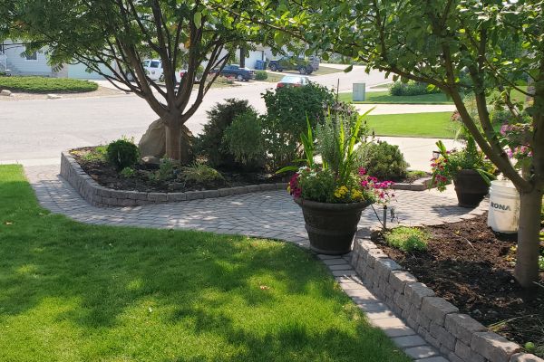 Valley-Ridge-Calgary-front-yard-stone-flowerbeds-cobble-stone-