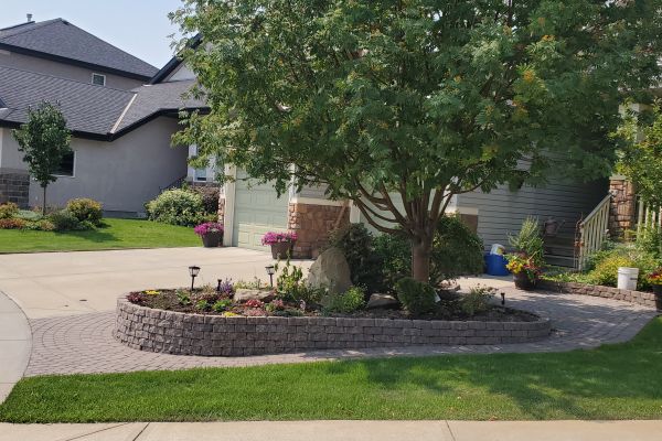 Valley-Ridge-Calgary-front-yard-stone-flowerbeds-cobble-stone-