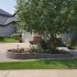 Valley-Ridge-Calgary-front-yard-stone-flowerbeds-cobble-stone-