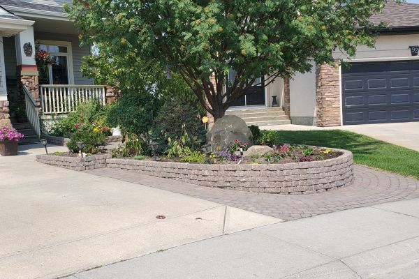 Valley-Ridge-Calgary-front-yard-stone-flowerbeds-cobble-stone-