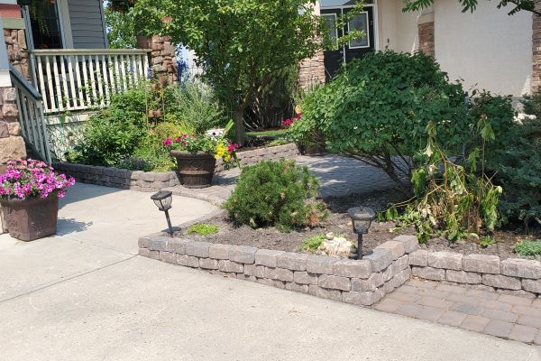 Valley-Ridge-Calgary-front-yard-stone-flowerbeds-cobble-stone-