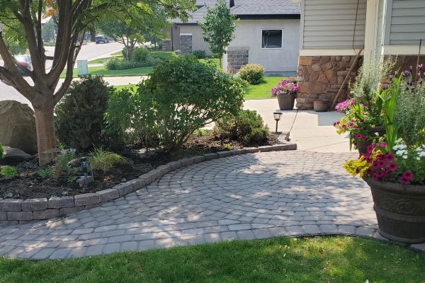 Valley-Ridge-Calgary-front-yard-stone-flowerbeds-cobble-stone-