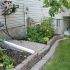 Valley-Ridge-Calgary-front-yard-stone-flowerbeds-cobble-stone-